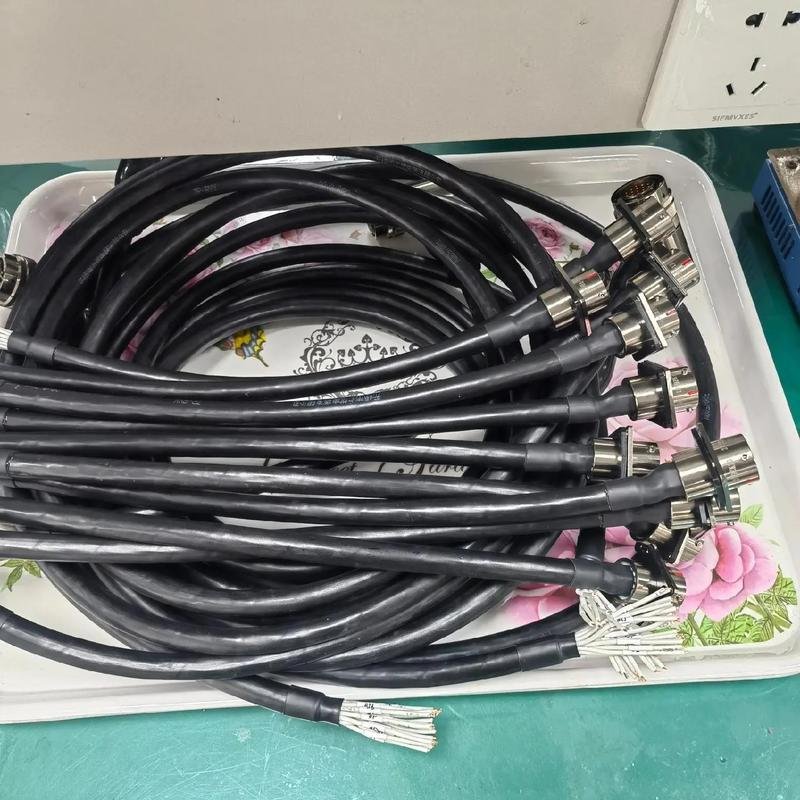 Finished cable assemblies with connectors undergoing quality inspection at Nexharn manufacturing