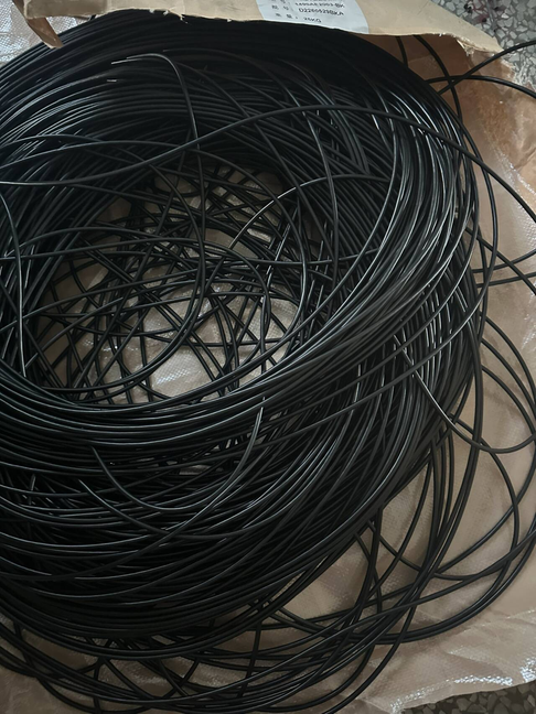 Black cable material prepared before coiling