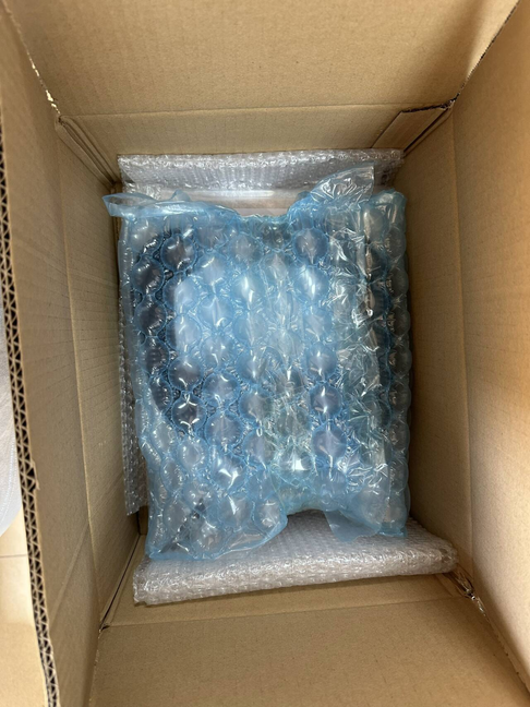 Protective carton packaging for custom coiled cables