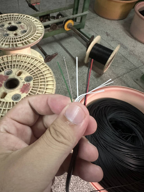 Multi-core conductor detail for a custom coiled cable